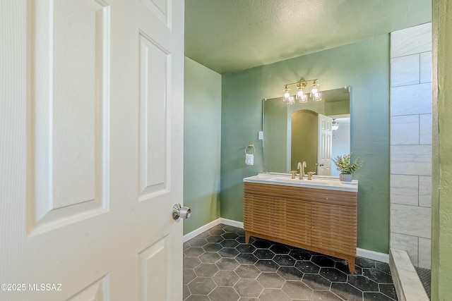 bathroom with vanity and tile patterned flooring