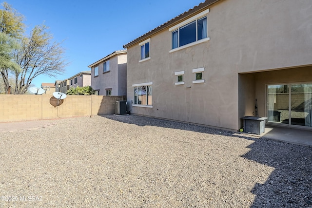 back of property featuring a patio and central air condition unit