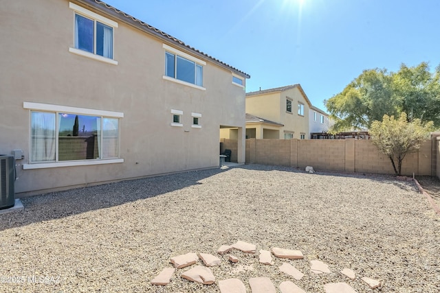 back of property with cooling unit