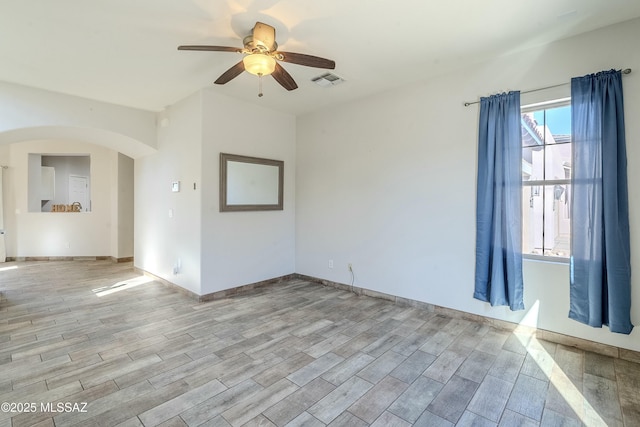 unfurnished room with ceiling fan and light hardwood / wood-style floors