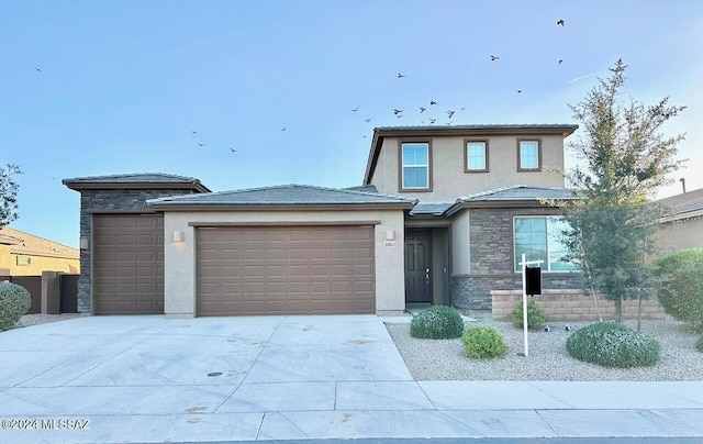 prairie-style home featuring a garage