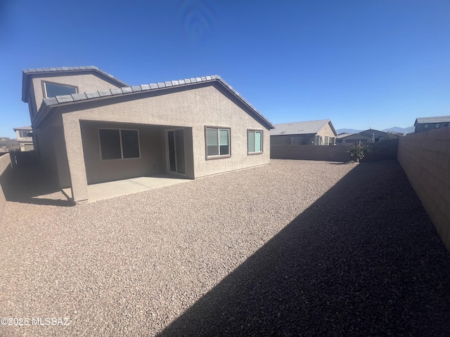 rear view of property with a patio