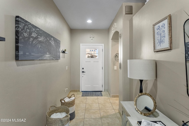 entryway featuring light tile patterned floors