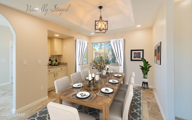 dining area featuring a chandelier