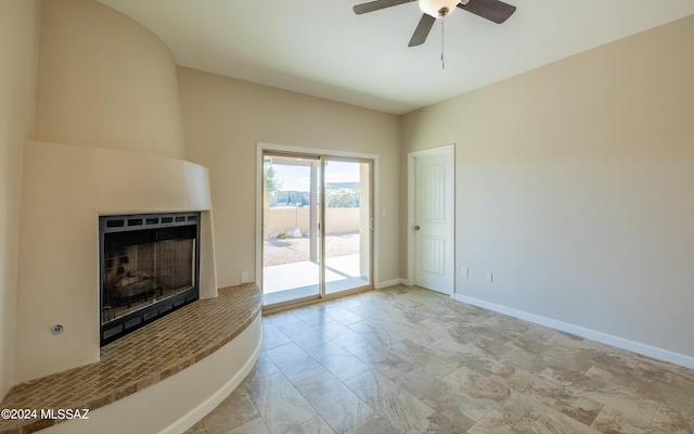 unfurnished living room featuring ceiling fan