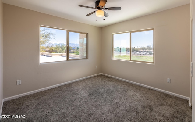 carpeted empty room with ceiling fan