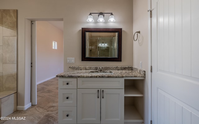 bathroom featuring vanity and a shower with shower door