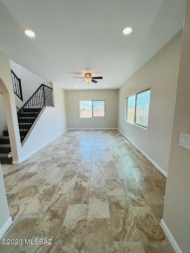 unfurnished room featuring ceiling fan