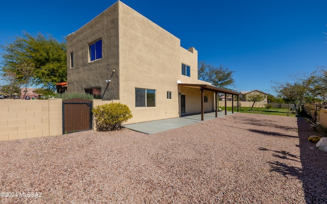 back of house with a patio area