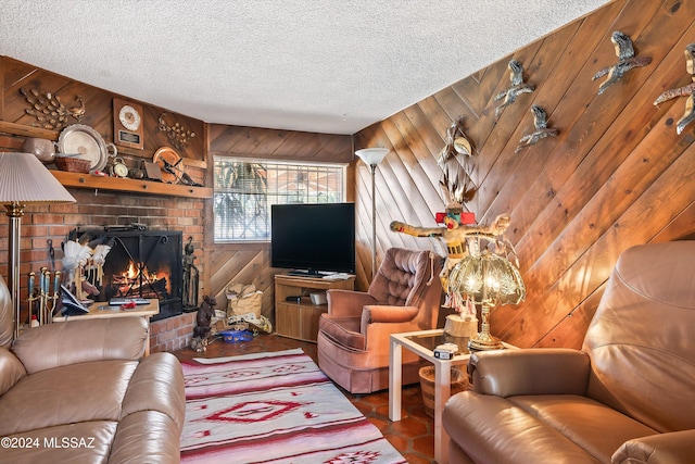 living room with a textured ceiling, a fireplace, wood-type flooring, and wood walls