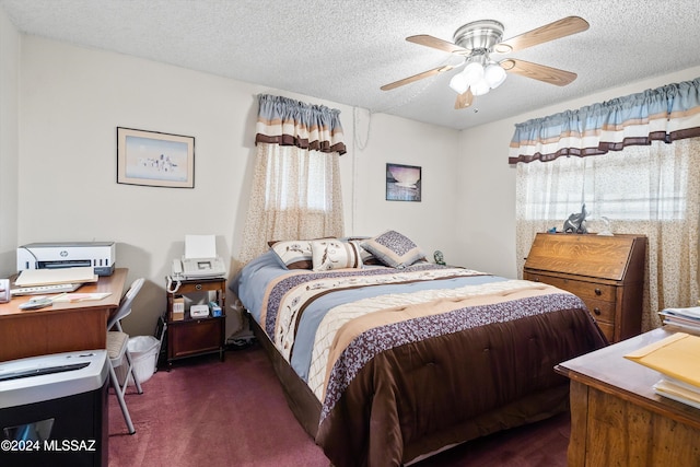 carpeted bedroom featuring a textured ceiling and ceiling fan