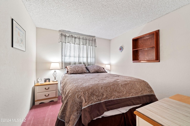 bedroom featuring a textured ceiling and carpet flooring