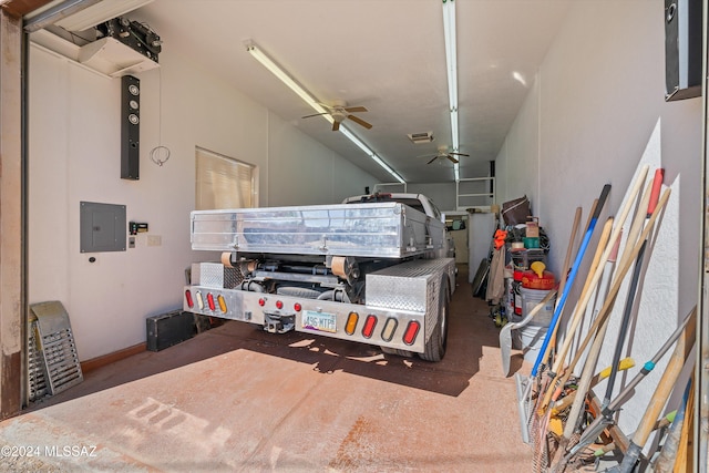 garage featuring electric panel and ceiling fan