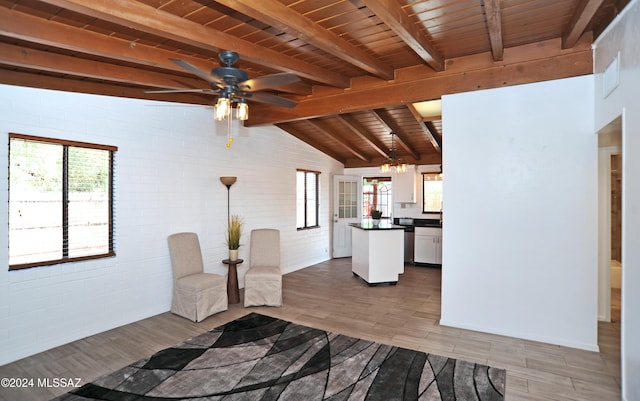 unfurnished room with wood ceiling, ceiling fan, wood-type flooring, lofted ceiling with beams, and brick wall