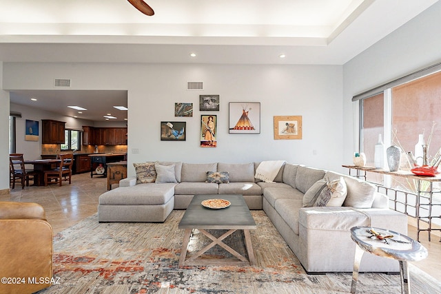 living room with light tile patterned floors and plenty of natural light