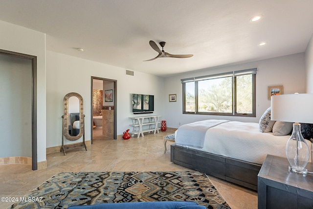 bedroom with ceiling fan and ensuite bath