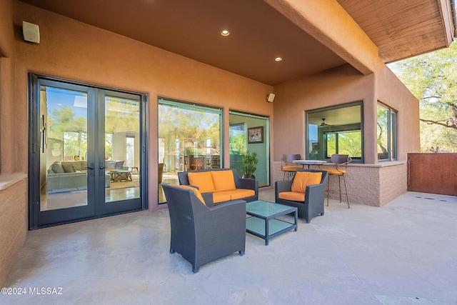 view of patio featuring french doors and an outdoor living space