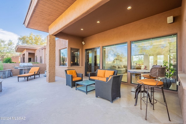 view of patio / terrace featuring an outdoor living space and a grill