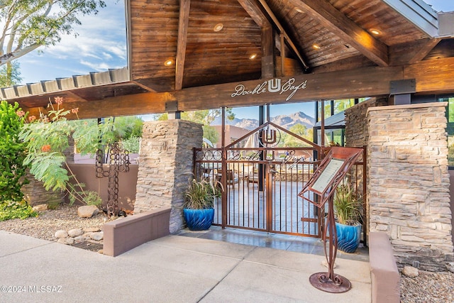 view of gate with a mountain view