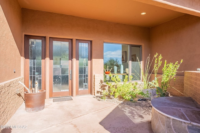 entrance to property featuring a patio