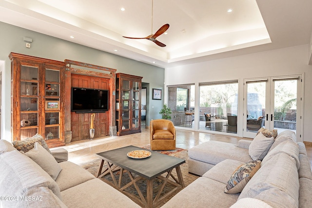 living room with french doors, ceiling fan, high vaulted ceiling, and plenty of natural light