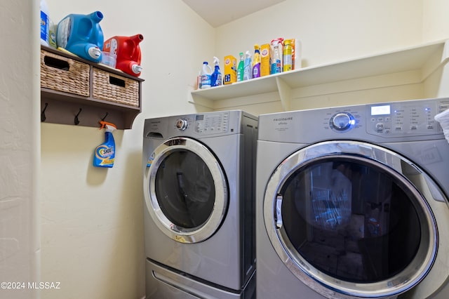 washroom featuring washer and clothes dryer