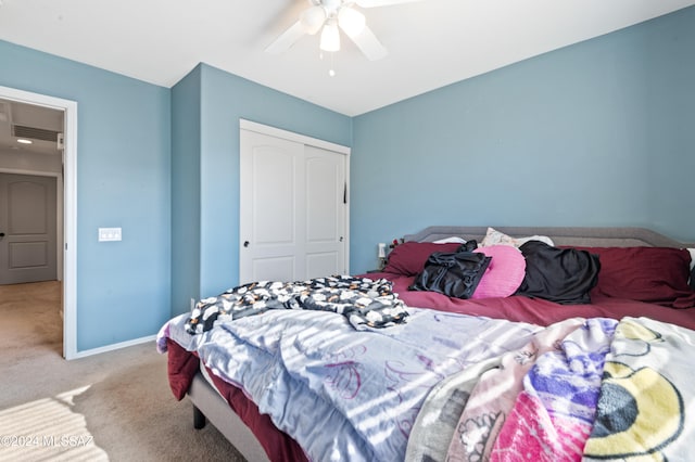 carpeted bedroom with a closet and ceiling fan