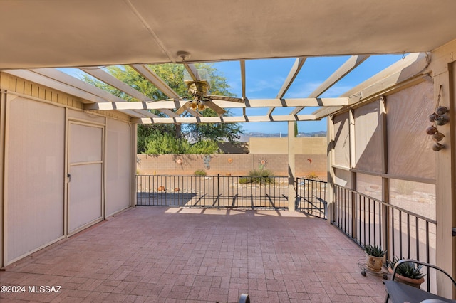 view of patio / terrace featuring fence