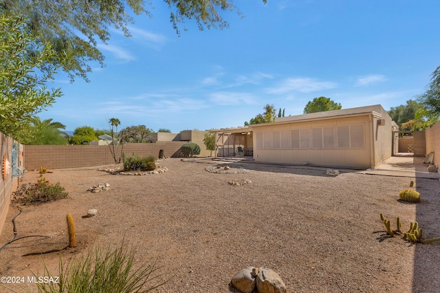 exterior space featuring a fenced backyard