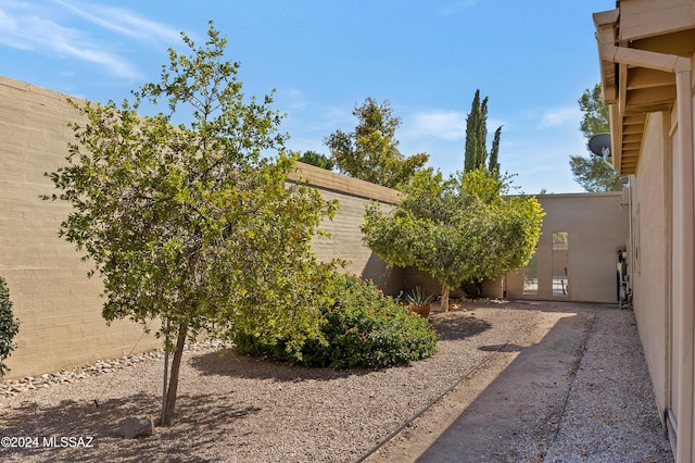 view of property exterior with fence and stucco siding