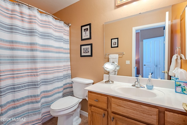 bathroom featuring vanity, toilet, a shower with curtain, and tile patterned flooring