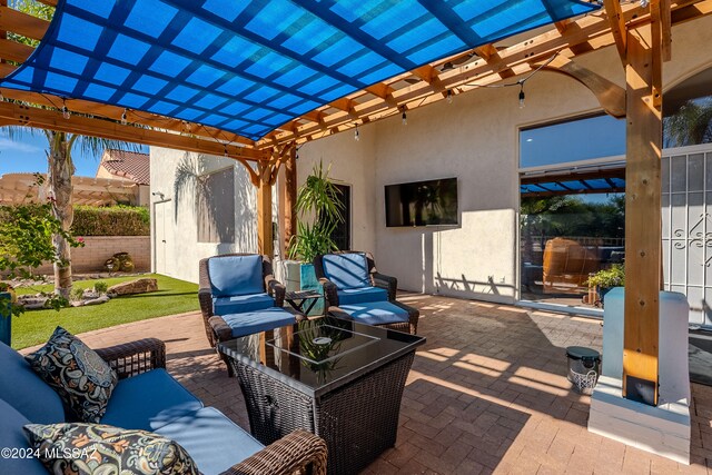 view of patio with outdoor lounge area and a pergola