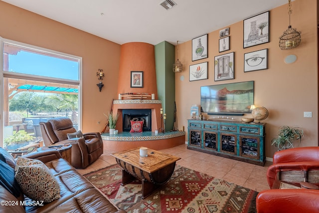 tiled living room featuring a fireplace