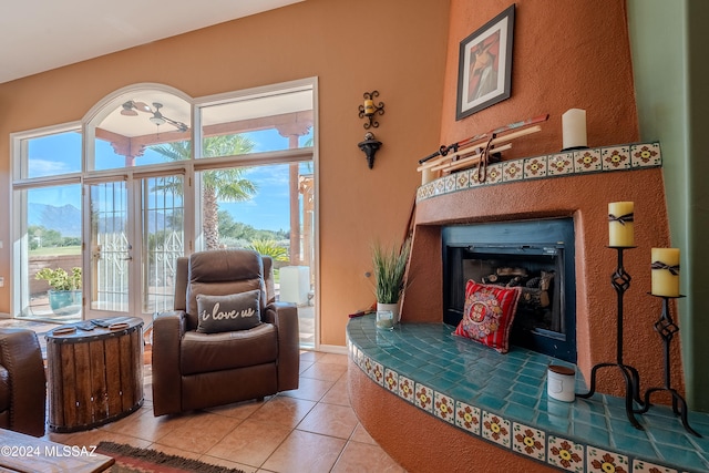 living area featuring tile patterned floors and a tile fireplace