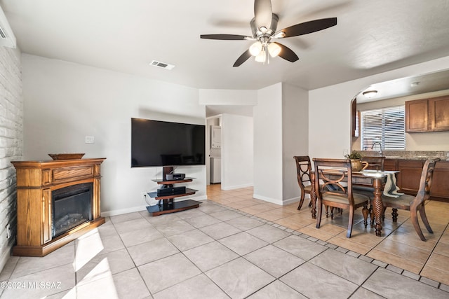 dining room with ceiling fan and light tile patterned floors