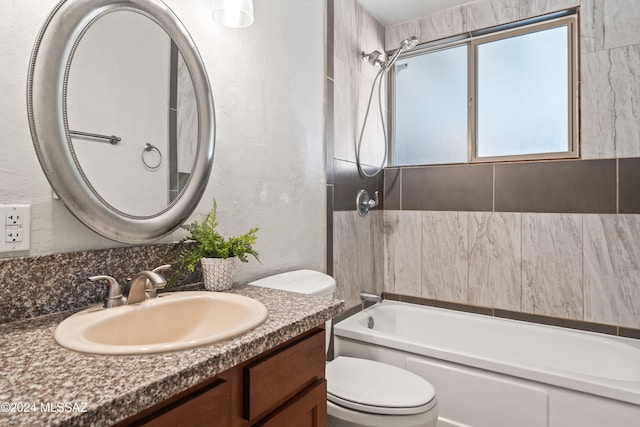 bathroom featuring vanity, toilet, and a bath