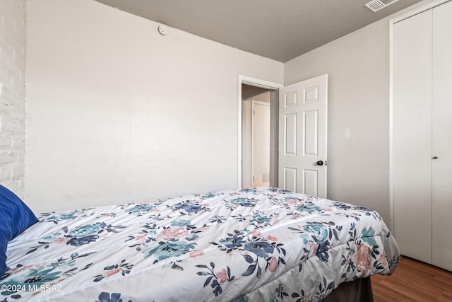 bedroom featuring a closet and hardwood / wood-style floors