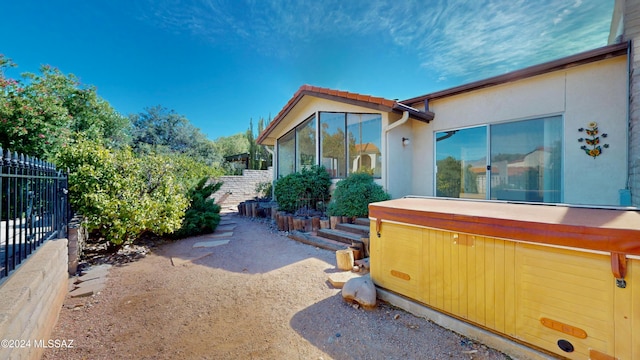 view of side of home with a sunroom