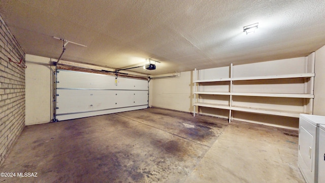 garage featuring a garage door opener and washing machine and dryer