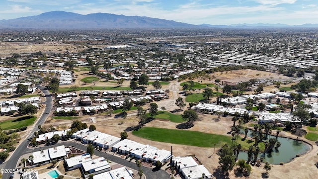 birds eye view of property with a water and mountain view