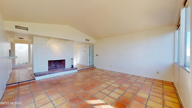 hallway featuring light tile patterned flooring, a sink, and visible vents