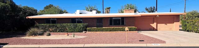 ranch-style home featuring a garage