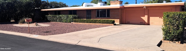 ranch-style house featuring a garage