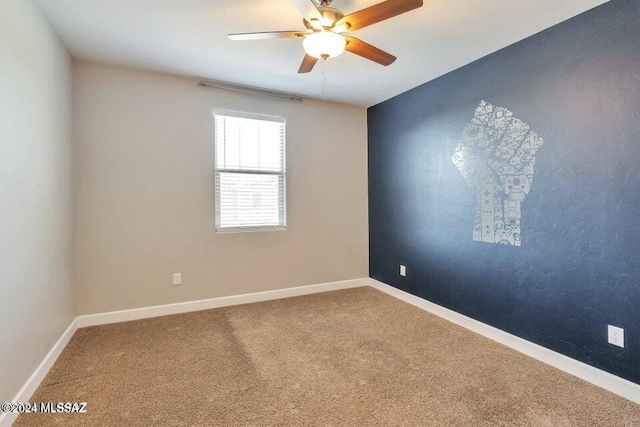 carpeted empty room with ceiling fan