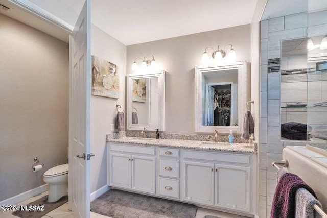 bathroom with vanity and toilet