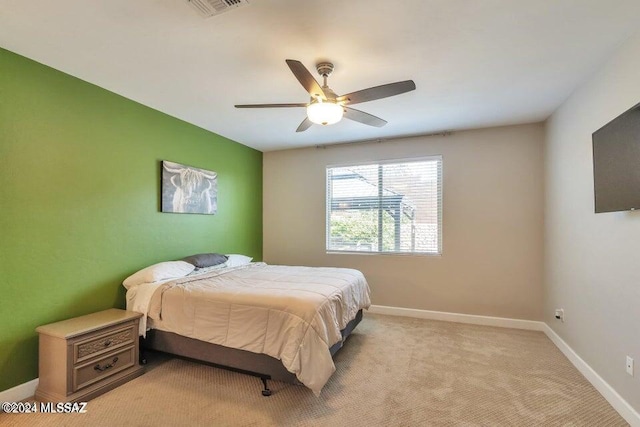 bedroom with light colored carpet and ceiling fan