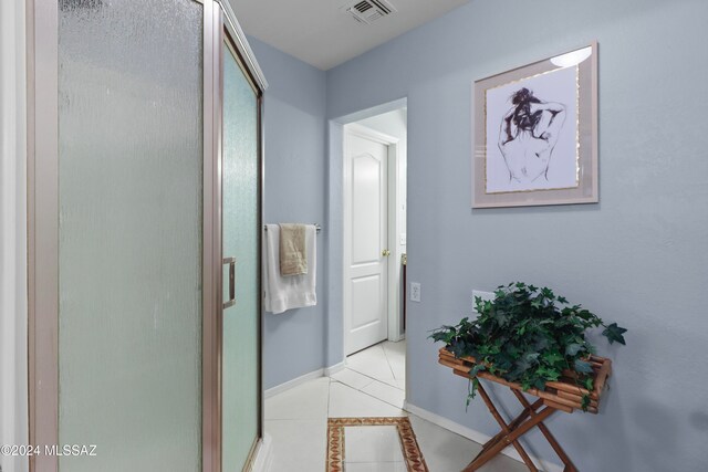 corridor with light tile patterned floors