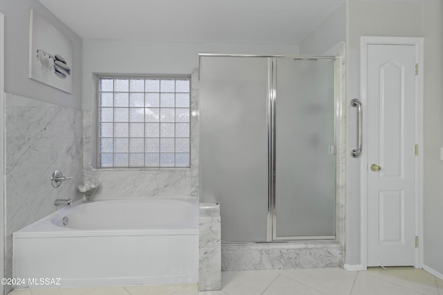 bathroom featuring separate shower and tub and tile patterned floors