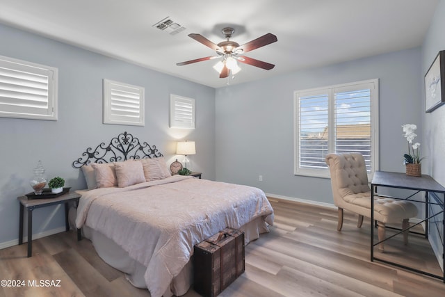 bedroom featuring light wood-type flooring and ceiling fan