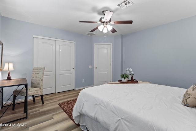 bedroom with ceiling fan and light wood-type flooring